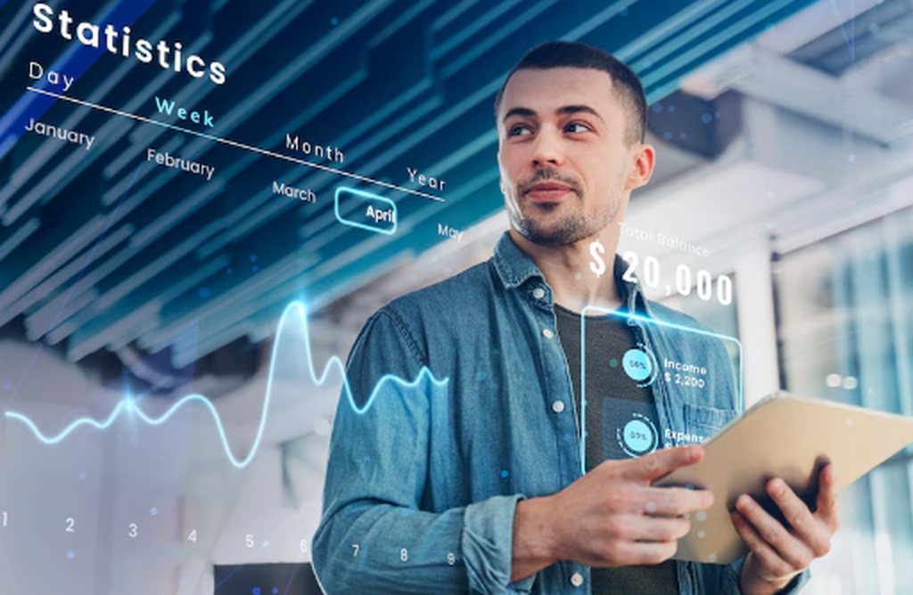 Young investor analyzing digital financial statistics and portfolio performance on a tablet, focusing on monthly income from ETFs and REITs in 2025.